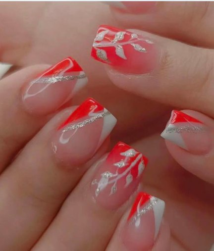 Red and silver nail art done at Glamin Salon