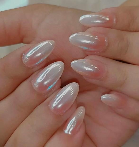 Glazed chrome almond nail extensions